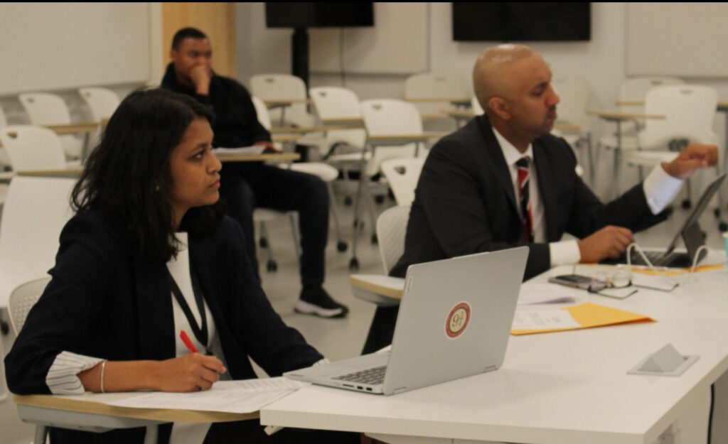 Two judges who are judging a moot round. 